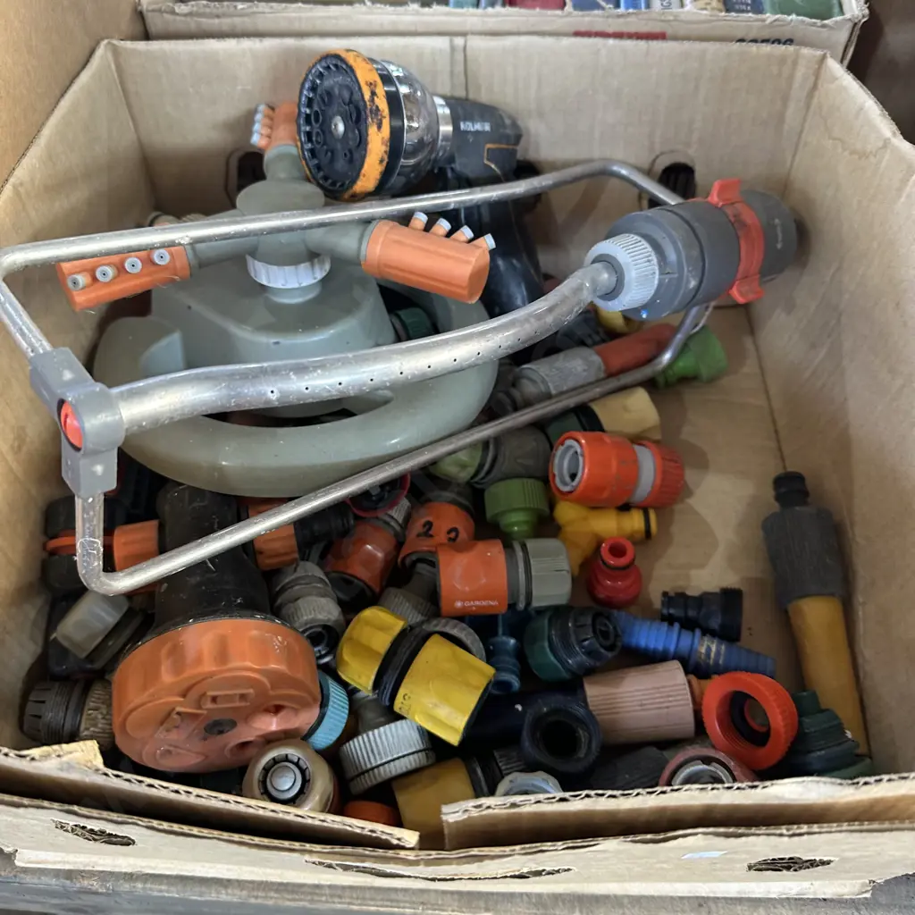 Box lot of hose fittings plus sprinklers. Image 1++