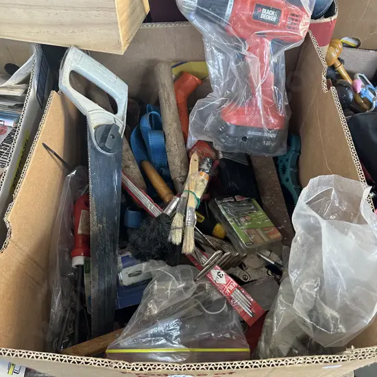 Box of tools and hardware including 12V battery drill.