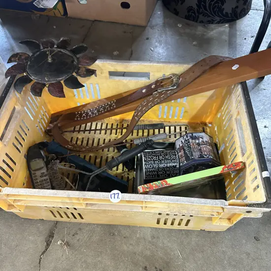 Vege crate of assorted items including old cellphone and belt etc.