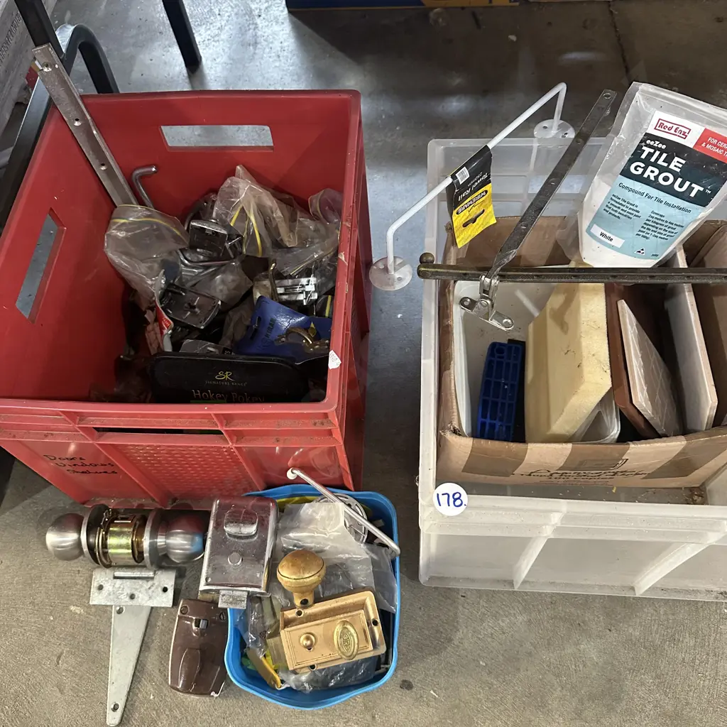 Two bins of door and window hardware plus tile grout etc. Image 1++
