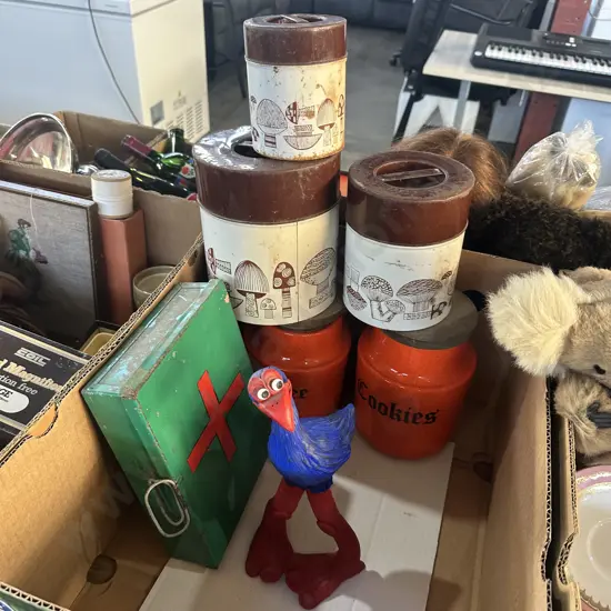 Vintage canisters, first aid box and pukeko statue.