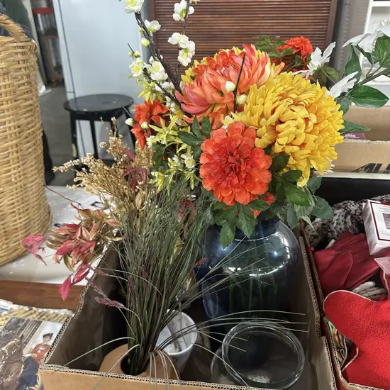 Glass and pottery vases plus flower arrangements.