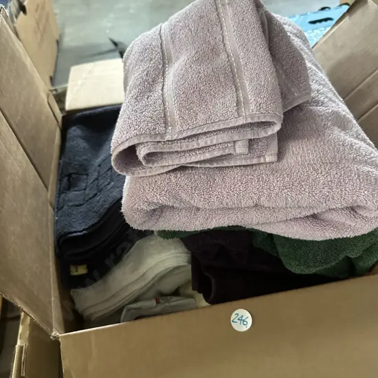 Box of towels and bedding.
