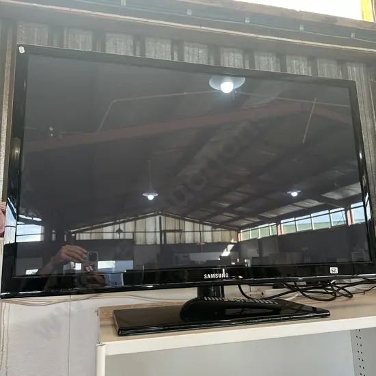 large Samsung TV with remote