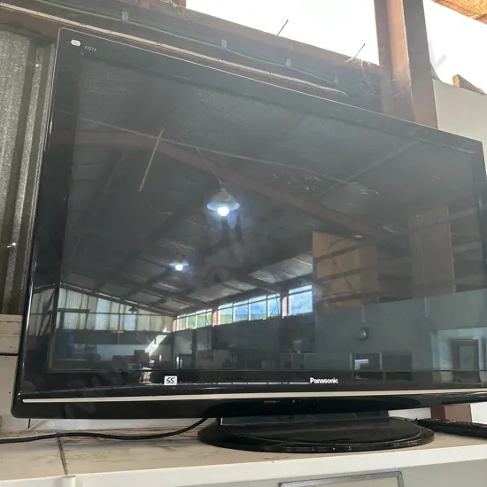 large Panasonic TV with console and remote