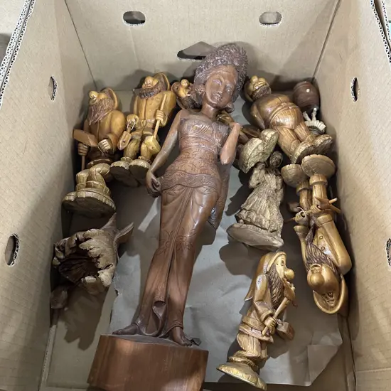 Box lot of carved figures.