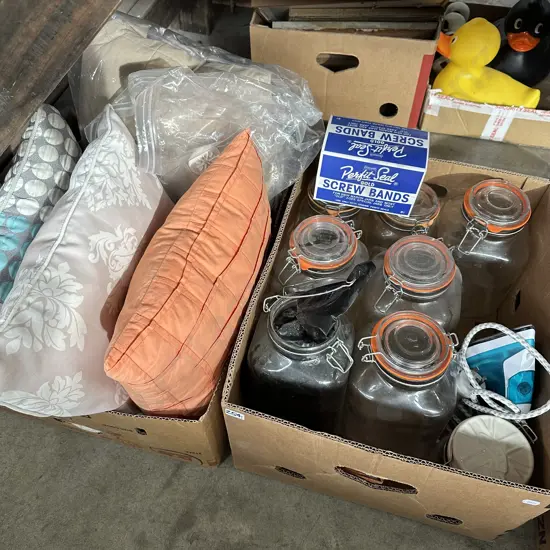 Two boxes lidded canisters and cushions and bedding etc.