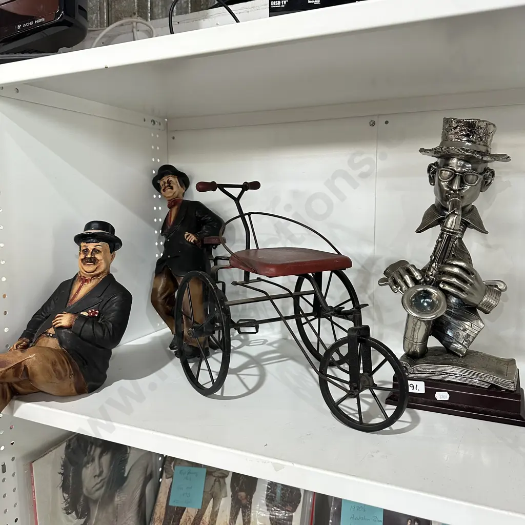 trumpet playing man, 2 figures and bike Image 1++