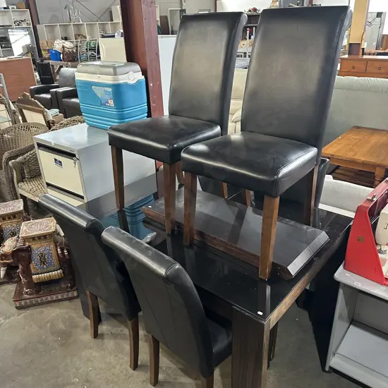extendable dining table and 6 leather chairs
