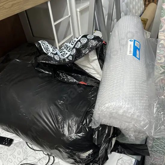bedding, curtains and bubble wrap
