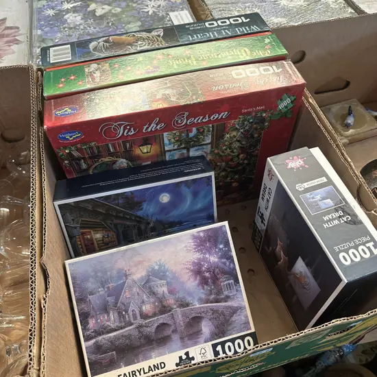 Box lot with six puzzles.
