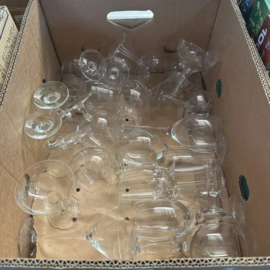 Box of glassware including hollow stem champagne saucers etc.