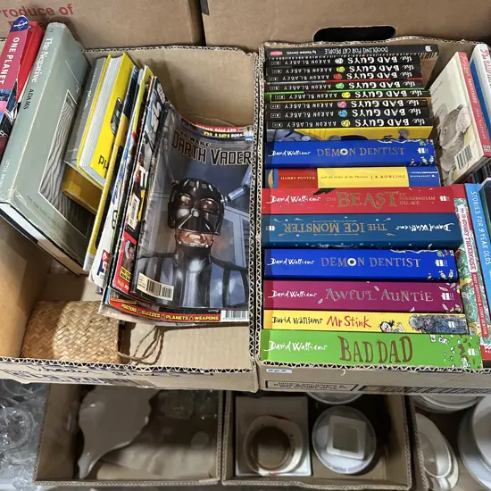 Two boxes of books and magazines including star wars darth vader.