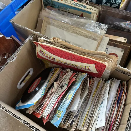 Box of 45s and 78s records.
