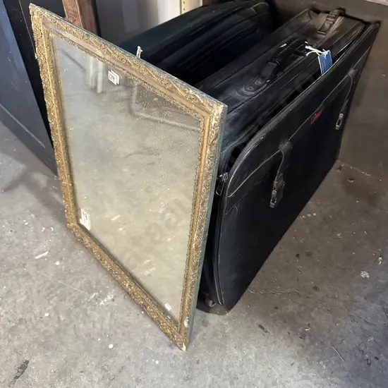 mirror and suitcases