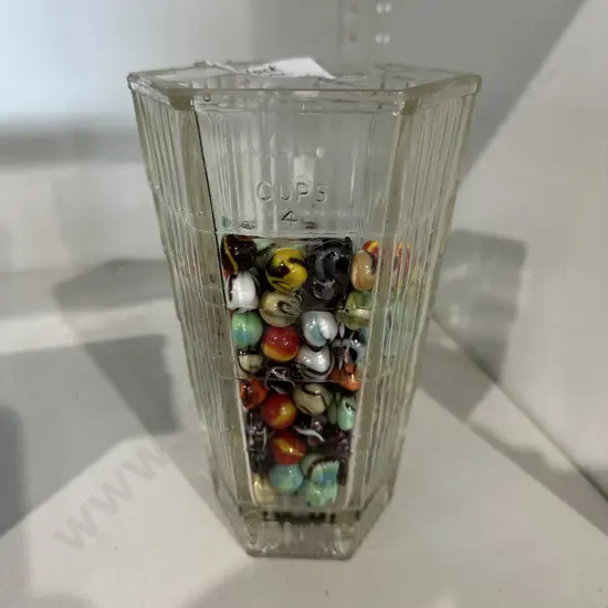 collection of vintage marbles in glass blender