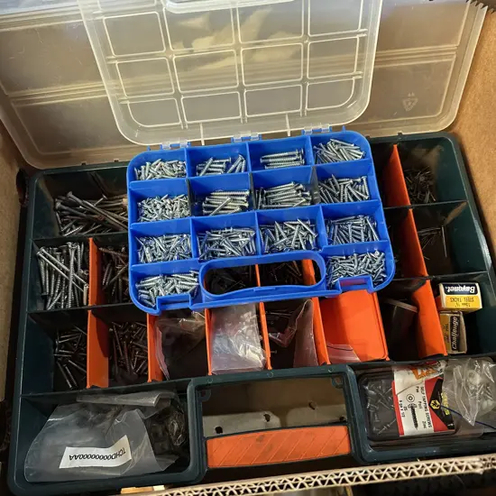 Two screw organisers and contents.