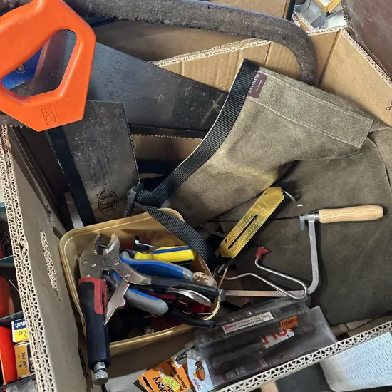 Box lot Taurus leather apron, saws, pliers, scales, screwdrivers etc.