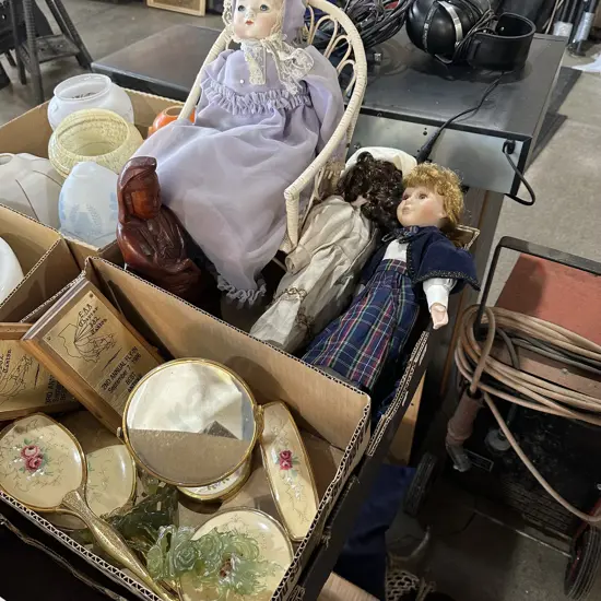 Box lot carved figure, dolls, brush and mirror set etc.