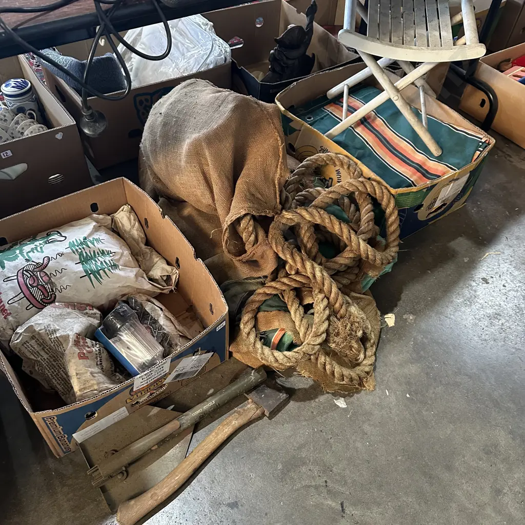 Canvases and rope, charcoal, tomahawk, folding shovel and solar light. Image 1++