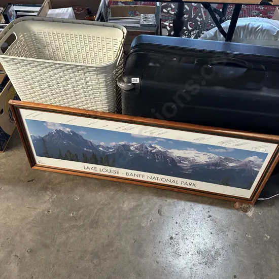 Laundry basket, large hard cover suitcase and Lake Louise picture etc.