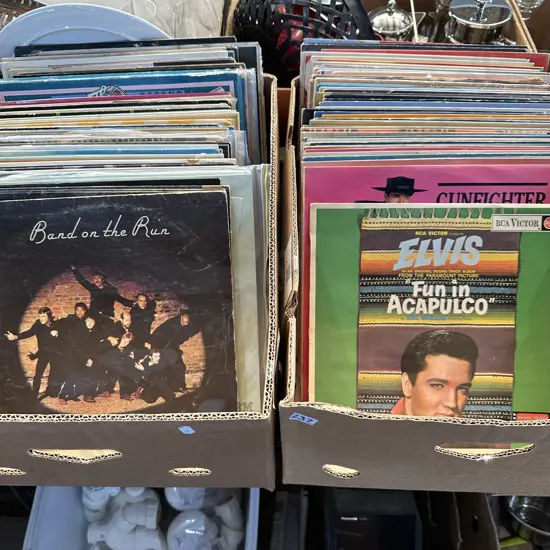 Two boxes of records including Paul McCartney and wings, Eric clapton and Elvis.