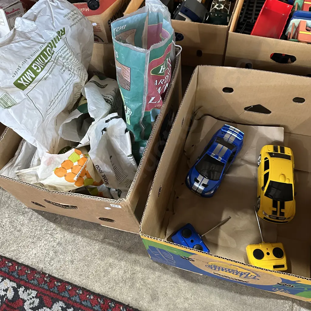 Two boxes gardening products plus pair remote controlled cars. Image 1++