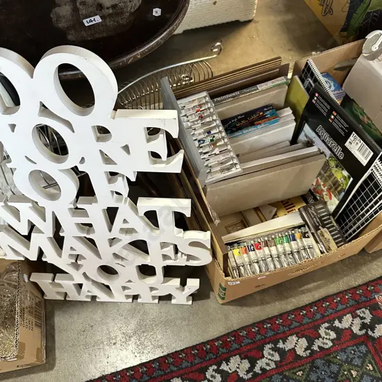 Box lot of sketch pads, canvases, oil paints, frames, wine table and art.