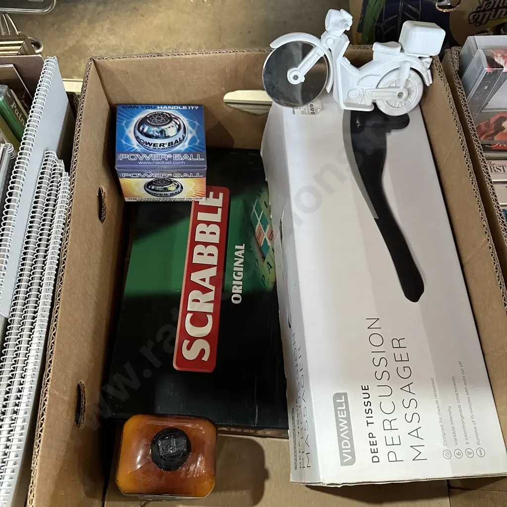 Box lot scrabble game, massager, aromatherapy bath salt and pizza cutter etc. Image 1++
