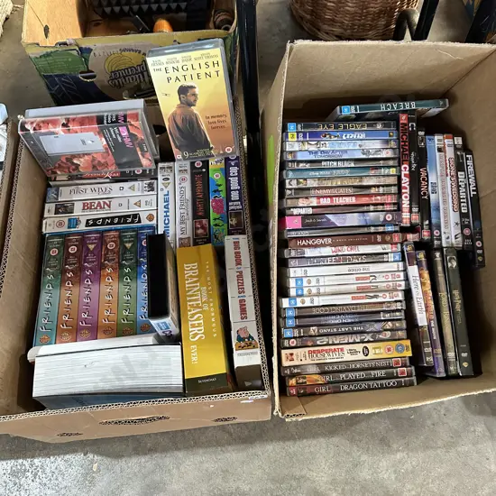 Two boxes of collectable videos and DVDs.