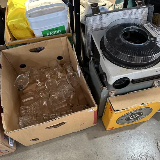 Box of glass and crystalware plus slide projector and case.