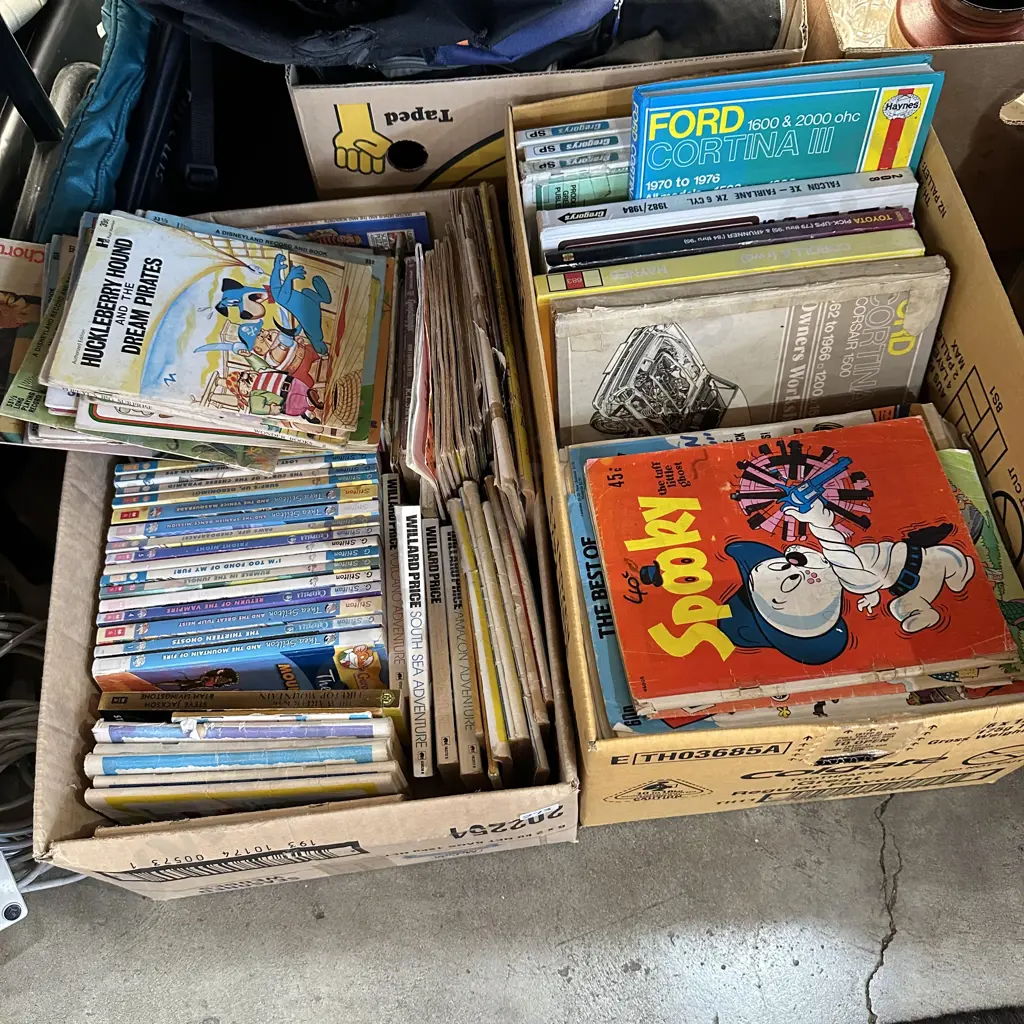 Two boxes childrens books, comics and car manuals. Image 1++