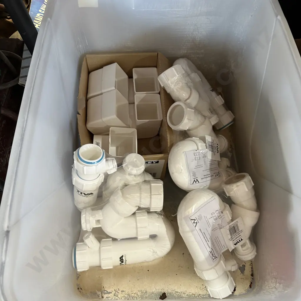 Bin of plumbing fittings. Image 1++