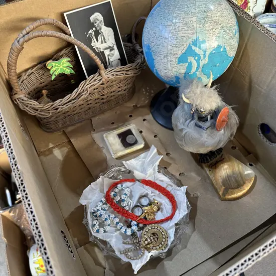 Box lot mini globe, native american dancer, costume jewelry, David Bowie postcard etc.