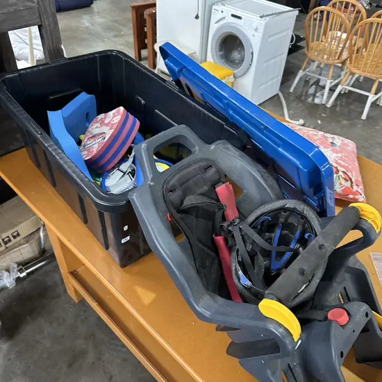 lidded bin with pool toys plus bike kid carrier etc