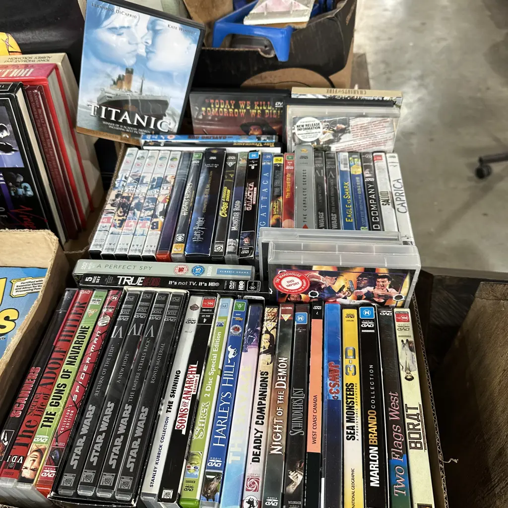 Two boxes of good movie DVDs. Image 1++