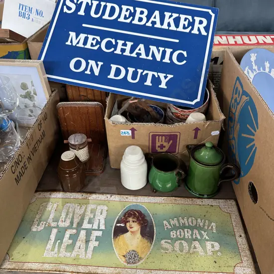 Box lot with insulators, book ends plus metal signs.
