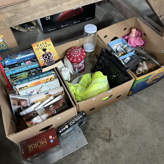 Three boxes Roses books, DVDs, game controller, hi-viz  etc.