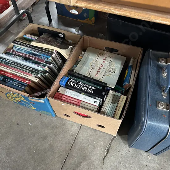 Two boxes of books and a suitcase.