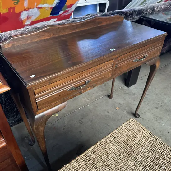 Solid pine hall table with two drawers.
