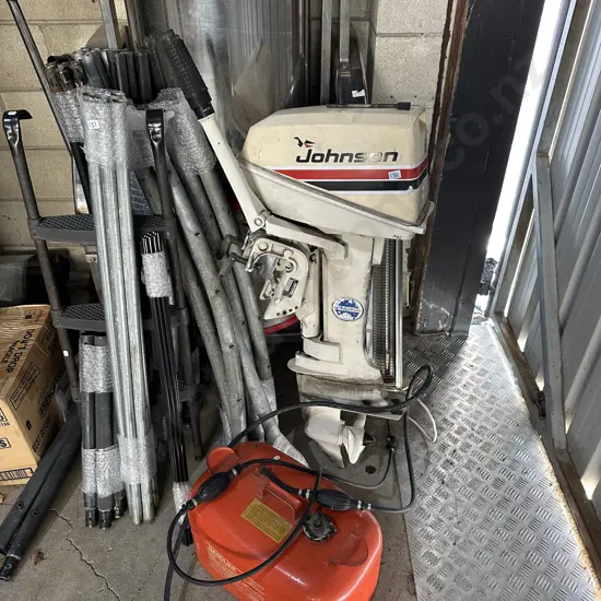Johnson outboard motor and fuel tank. Used in lake water, sold as working.