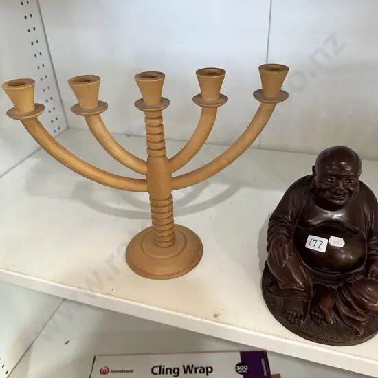 wooden candle stick and carved budda