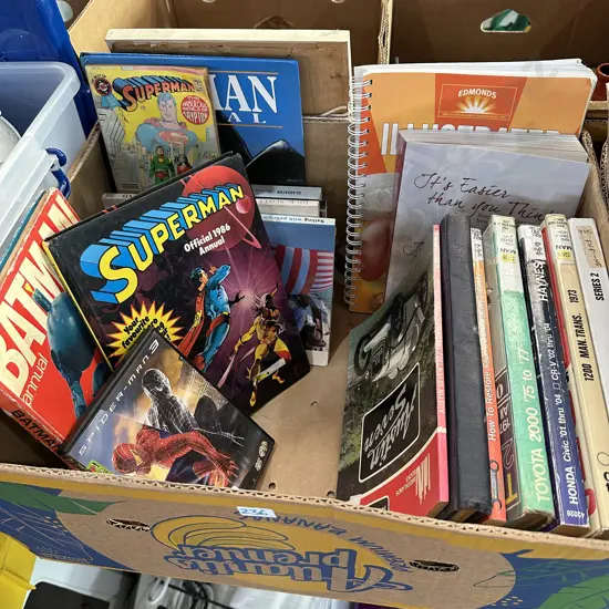 Box lot of books including car manuals, Batman and Superman comics etc.