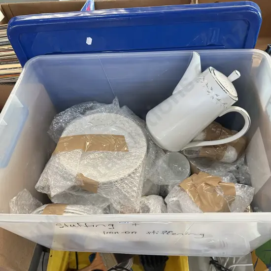 Lidded bin full of Japanese dinnerware.