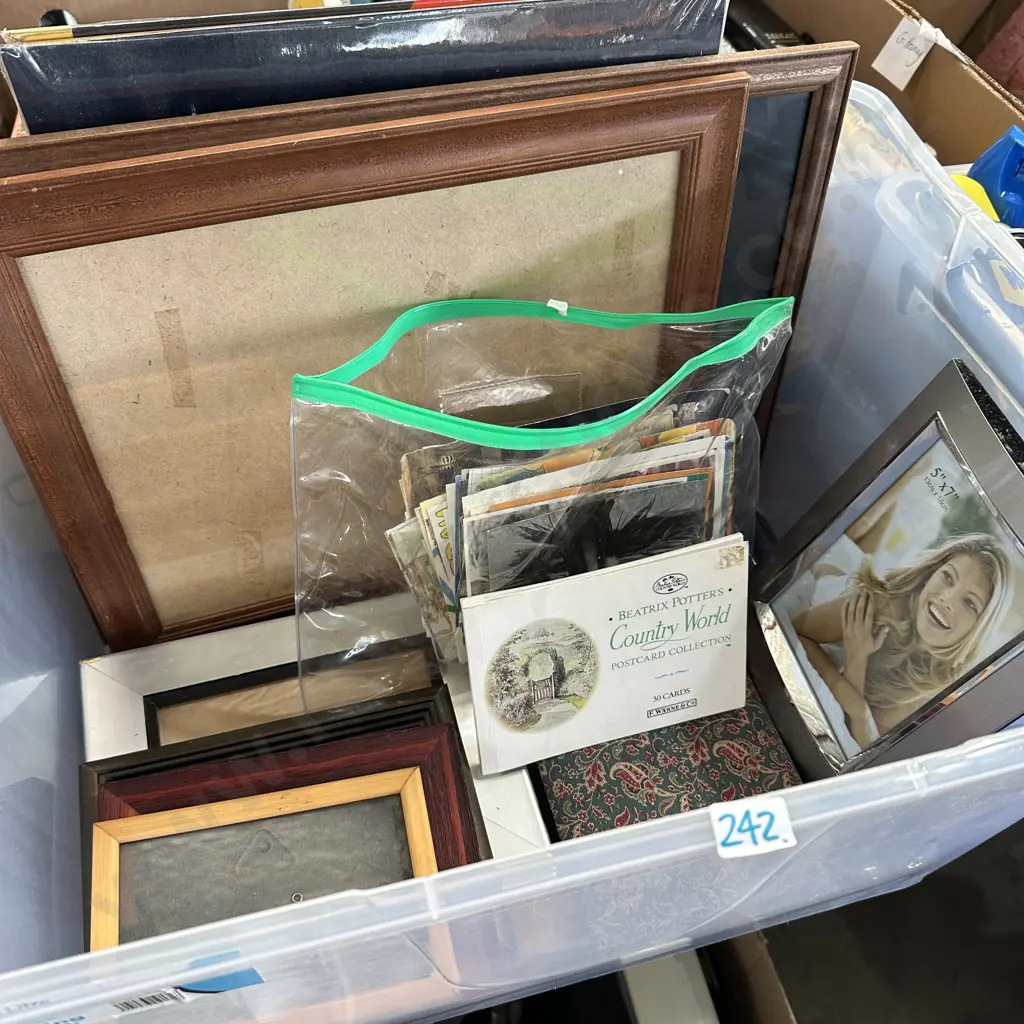 Bin with picture frames,  and postcard collection. Image 1++
