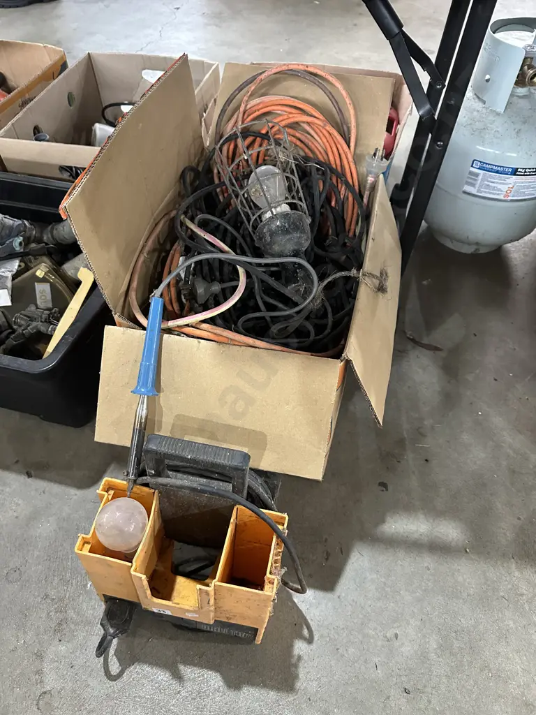 Box full of extension leads, work light, soldering iron etc. Image 1++