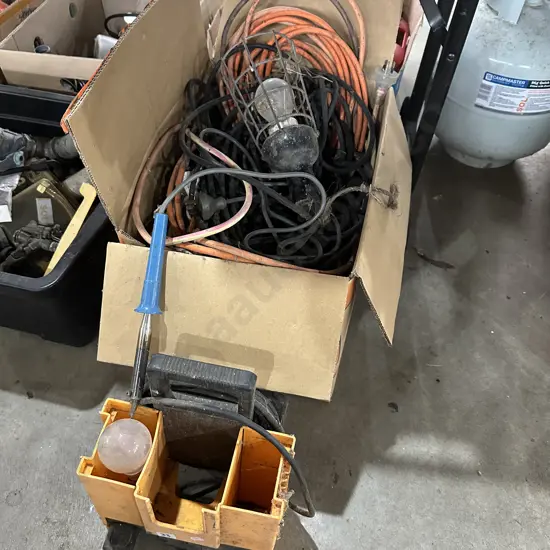 Box full of extension leads, work light, soldering iron etc.