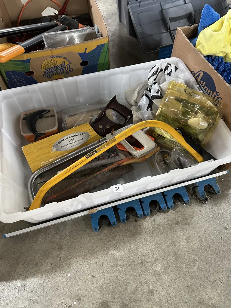 Lidded bin with assorted tools and hardware. Image 1++