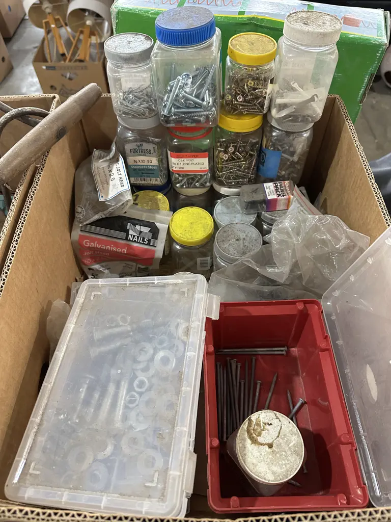 Box lot of screws, nails, washers, galvanized bolts nuts and washers, plus others. Image 1++