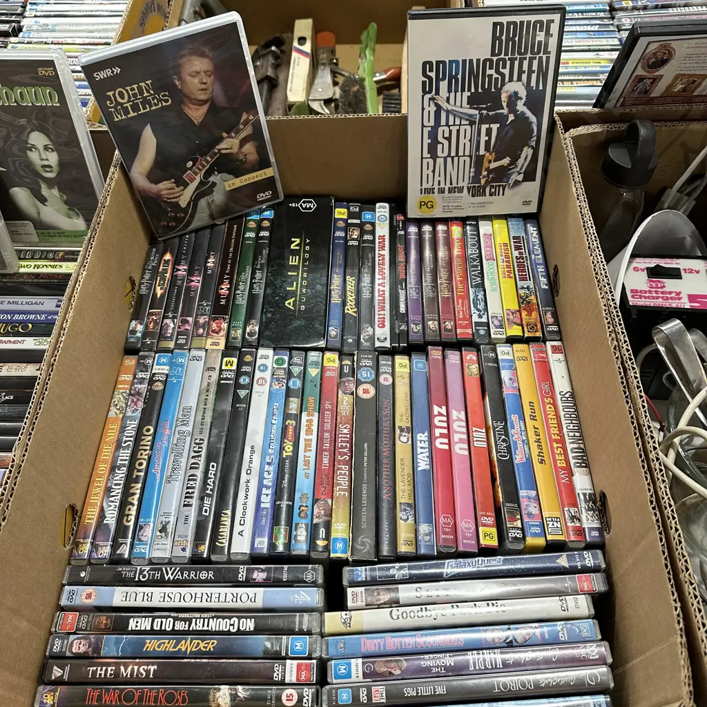 Box lot of DVD movies plus Bruce Springsteen live in NY. Image 1++